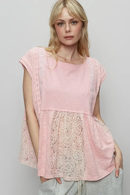 Blush pink lace peplum blouse with embroidered boat neck and cap sleeves, front view