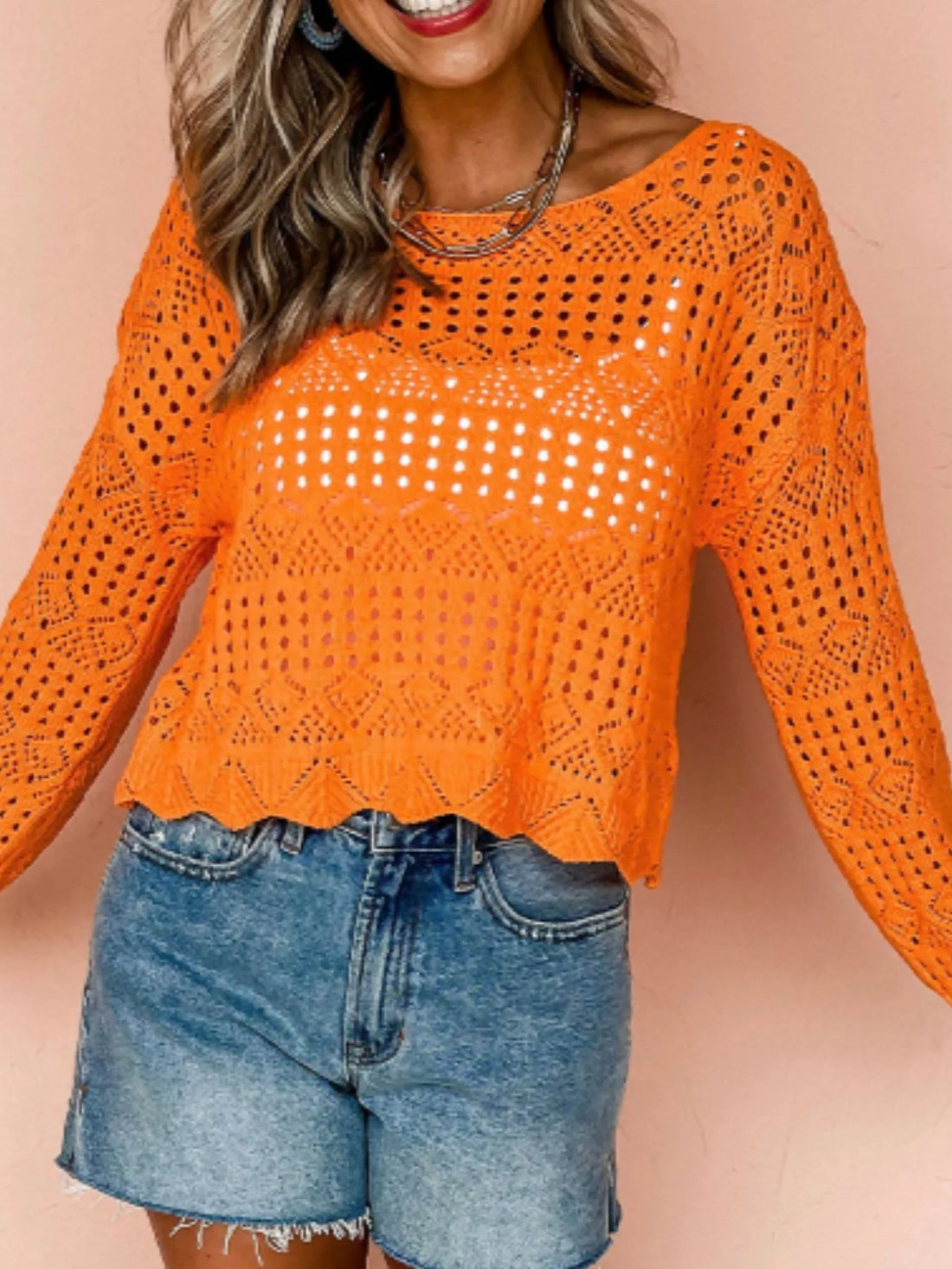 Orange crochet boat-neck knit cover-up with long sleeves and allover openwork eyelet pattern