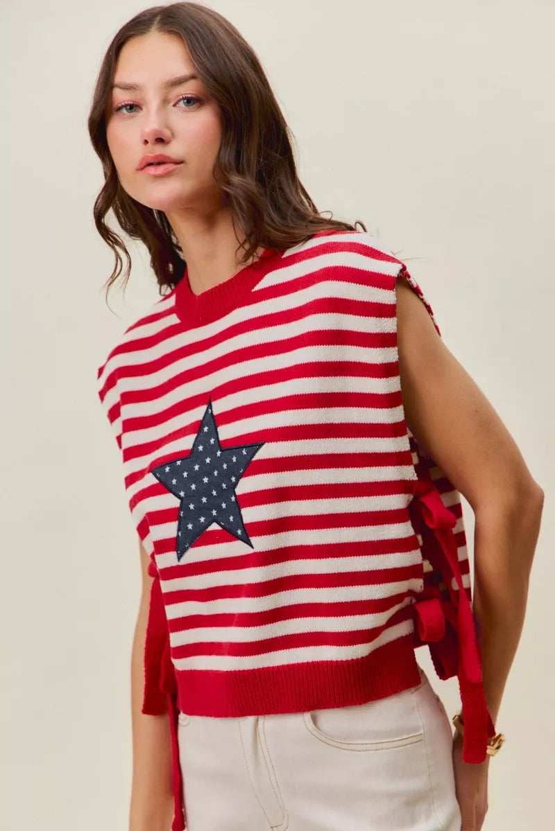 Red and ivory striped sleeveless vest top with navy star patch and long side tie strings