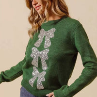 Hunter-green Christmas sweater with silver sequin bow ribbon detail at back
