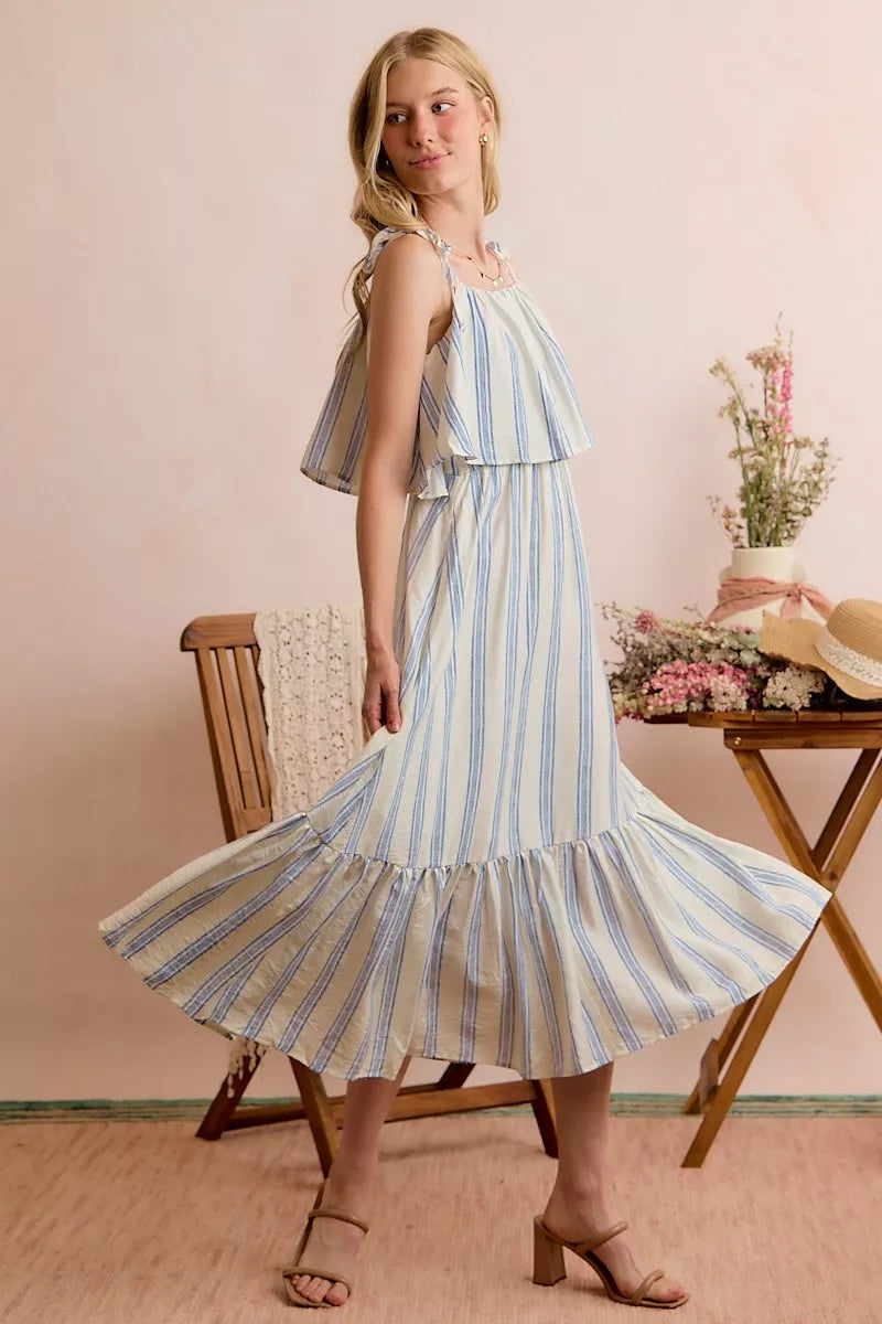 Blue and white striped tiered midi dress with ruffle shoulder detail and ties