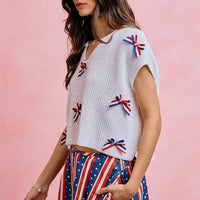 Off-white dolman sweater top with red, white & blue ribbon bow trim