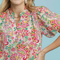 Pink mix paisley floral shift dress close-up with puff sleeve and V-neck