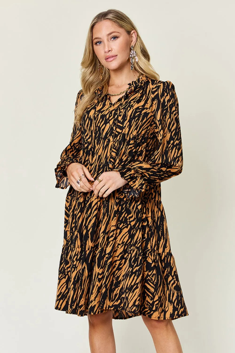 Caramel and black printed long-sleeve V-neck dress with gathered skirt