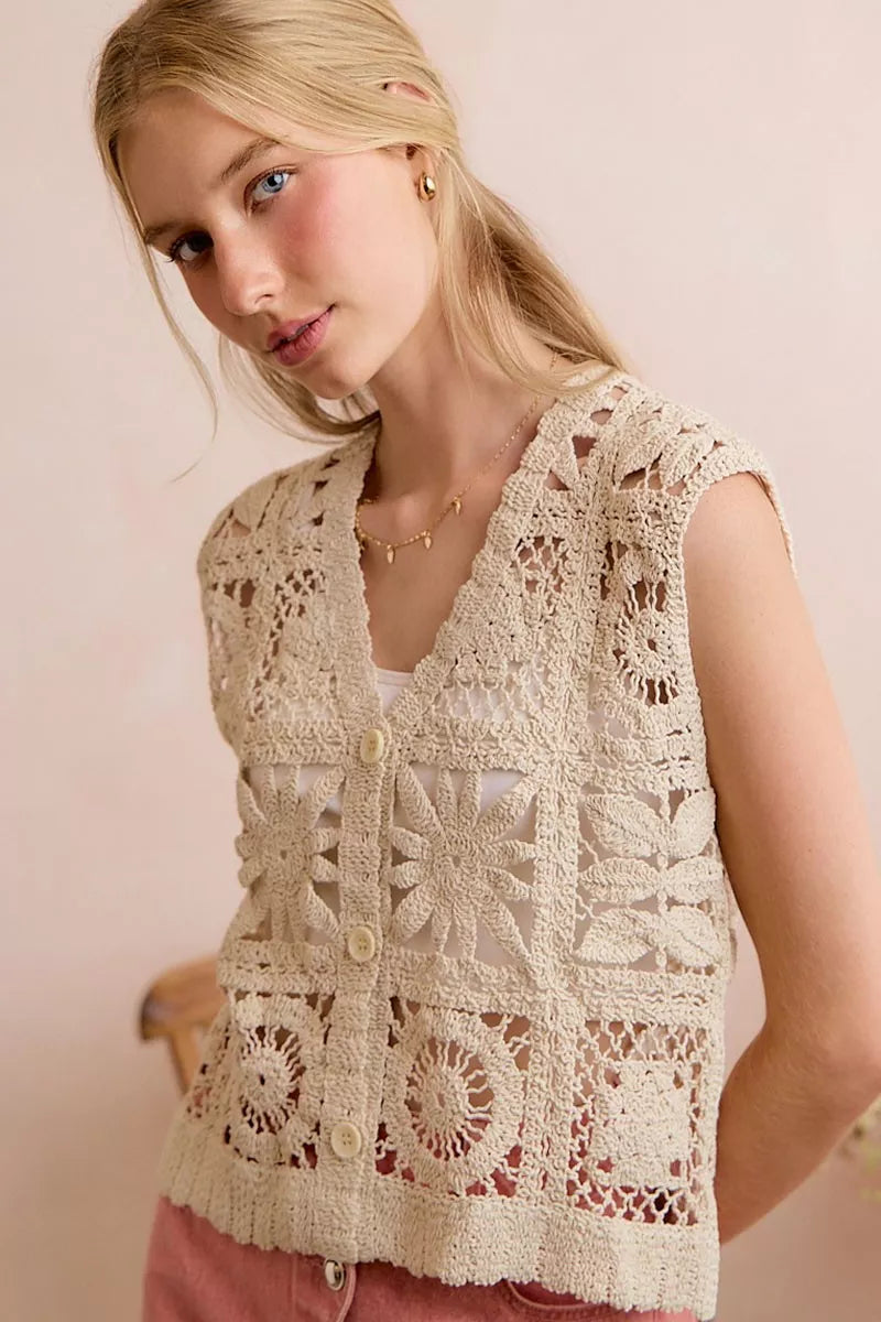 Natural crochet patterned sleeveless vest top with V-neck and button closure, oval lace panels