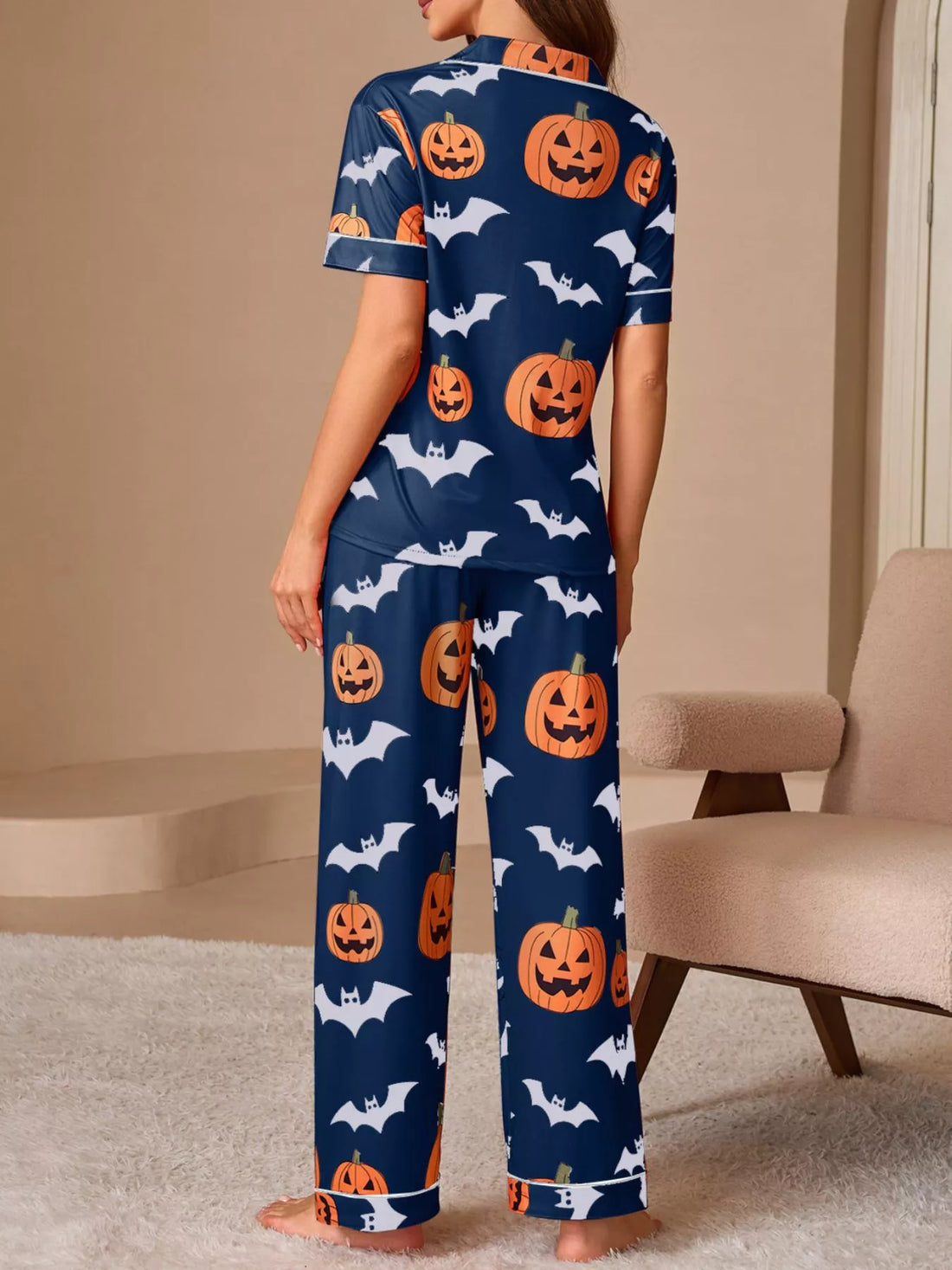 Navy pajama set with back button-up top and long lounge pants, pumpkin and bat print
