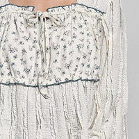 Cream lace square-neck bodice with drawstring tie, blue-trim edge and tiny floral print
