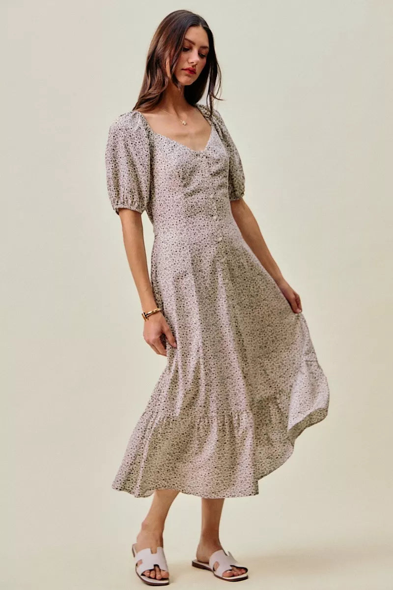Ditsy floral midi dress angled view, square neckline, puff sleeves, elastic waist