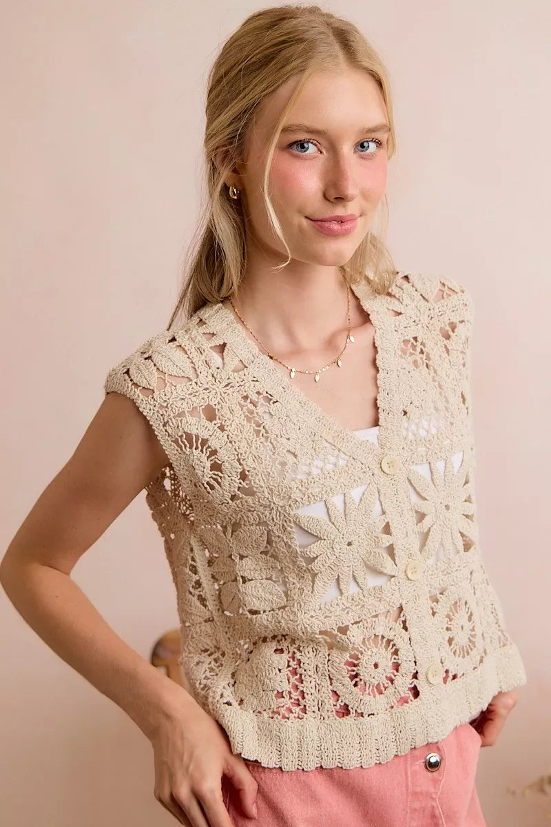 Natural crocheted sleeveless vest top with V-neck and button placket, floral lace pattern