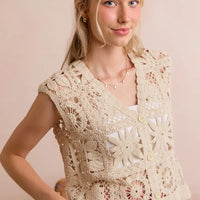 Natural crocheted sleeveless vest top with V-neck and button placket, floral lace pattern