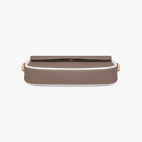 Brown leather small shoulder bag with snap flap closure and gold hardware