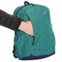 Teal Trespass ALDER backpack with a hand accessing its front zip pocket.
