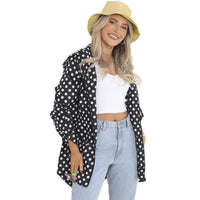 Black polka-dot rain mac with hood, front zip and drawstring hem