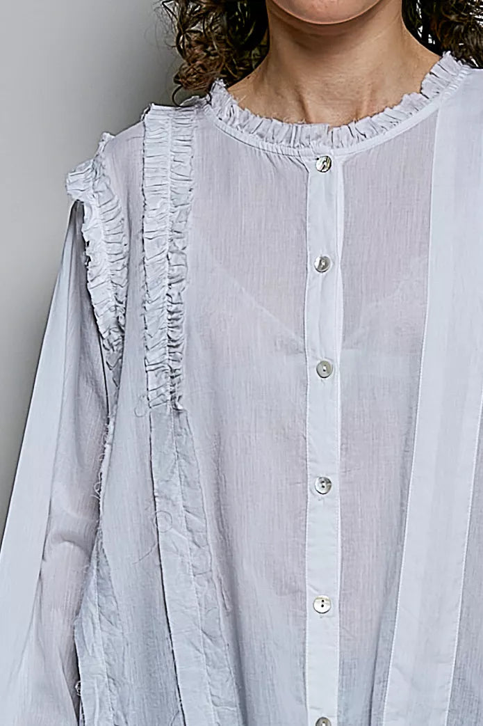 Ivory ruffle-trim round neck woven shirt close-up with button placket
