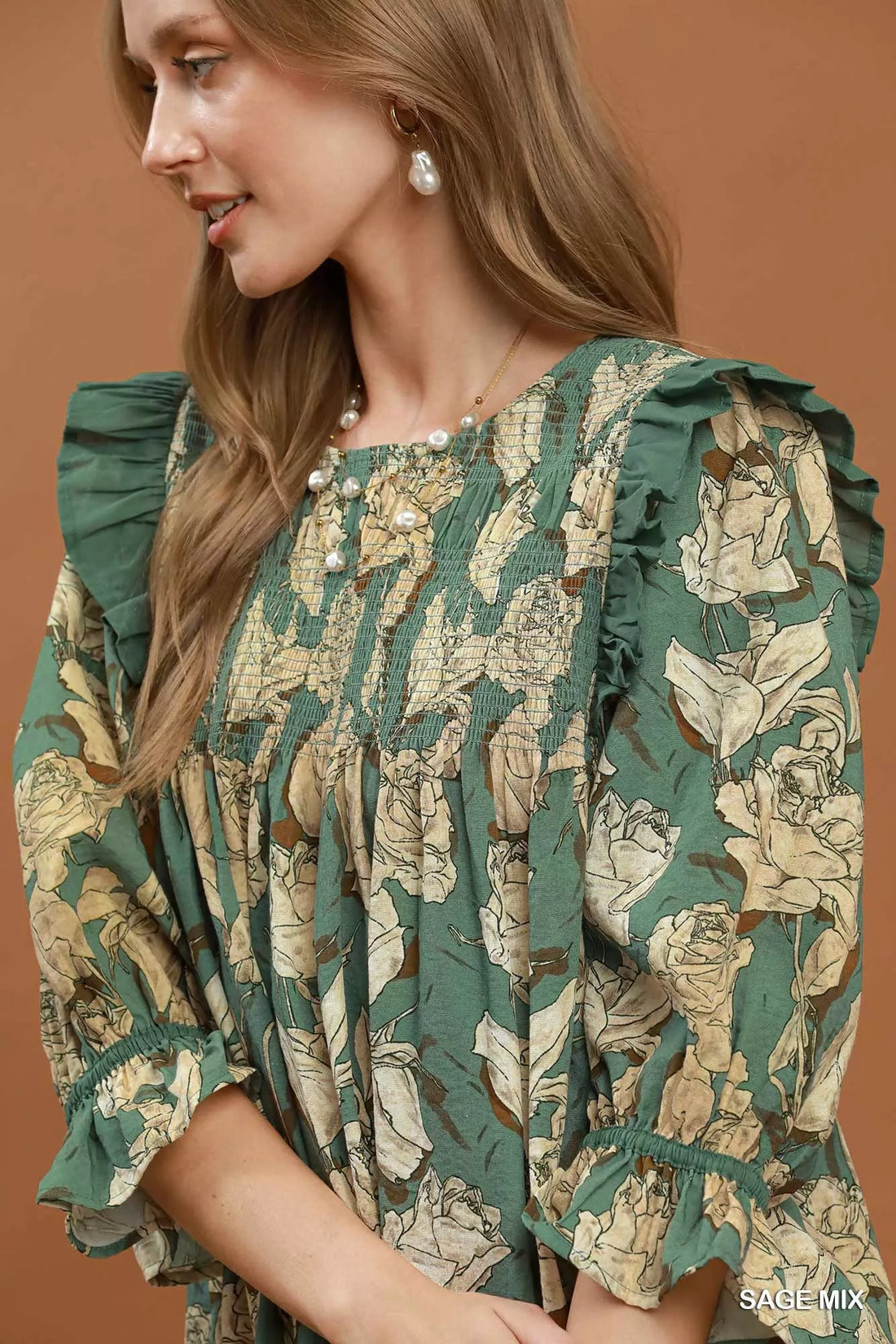 Sage floral smocked ruffle dress close-up with puff sleeves and detailed smocking