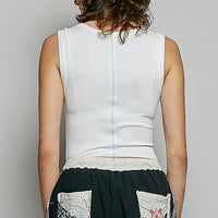 Off-white ribbed tank top, scoop back design with sleeveless cut