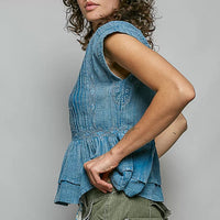 Denim blue sleeveless pintuck peplum blouse with ruffled hem and button front
