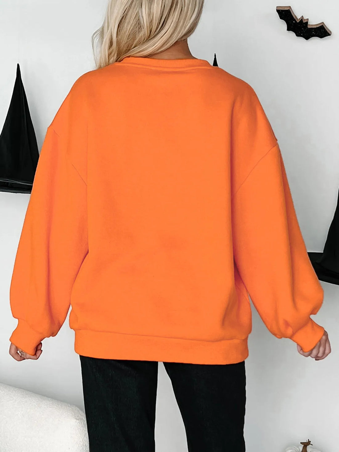 Orange sweatshirt back view with crewneck and long sleeves