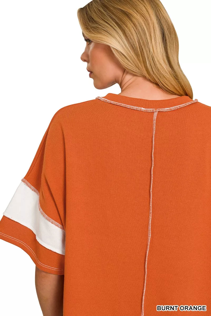 Burnt orange striped terry top with exposed center back seam and short sleeve