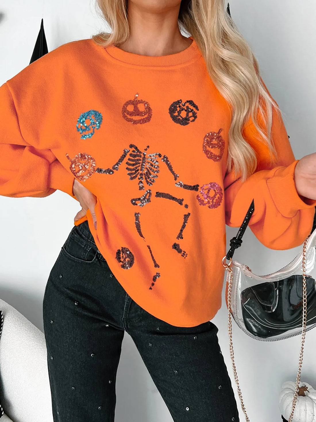Orange Halloween sweatshirt front with skeleton and pumpkin graphic