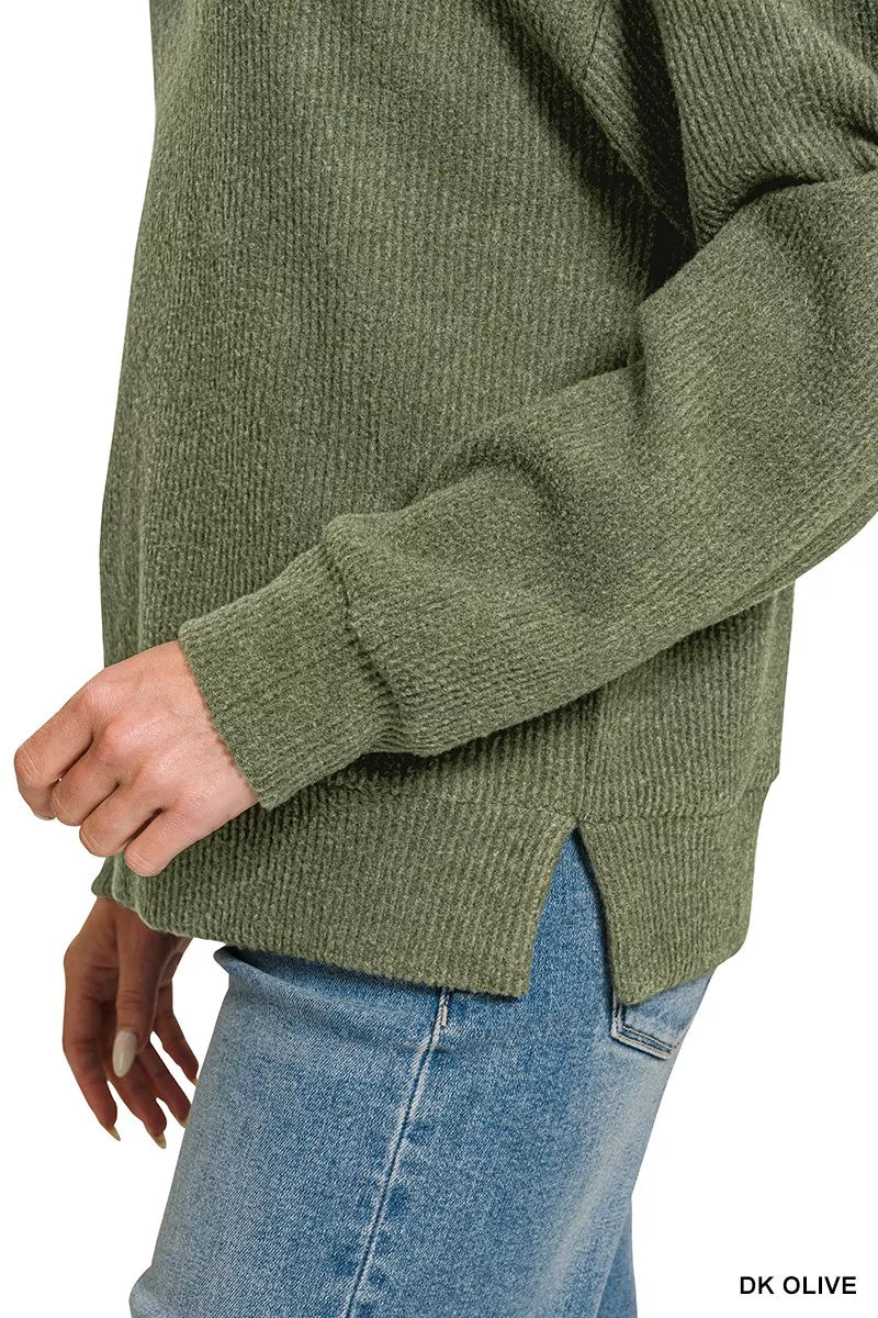 Dark olive ribbed sleeve cuff and textured knit fabric on hoodie