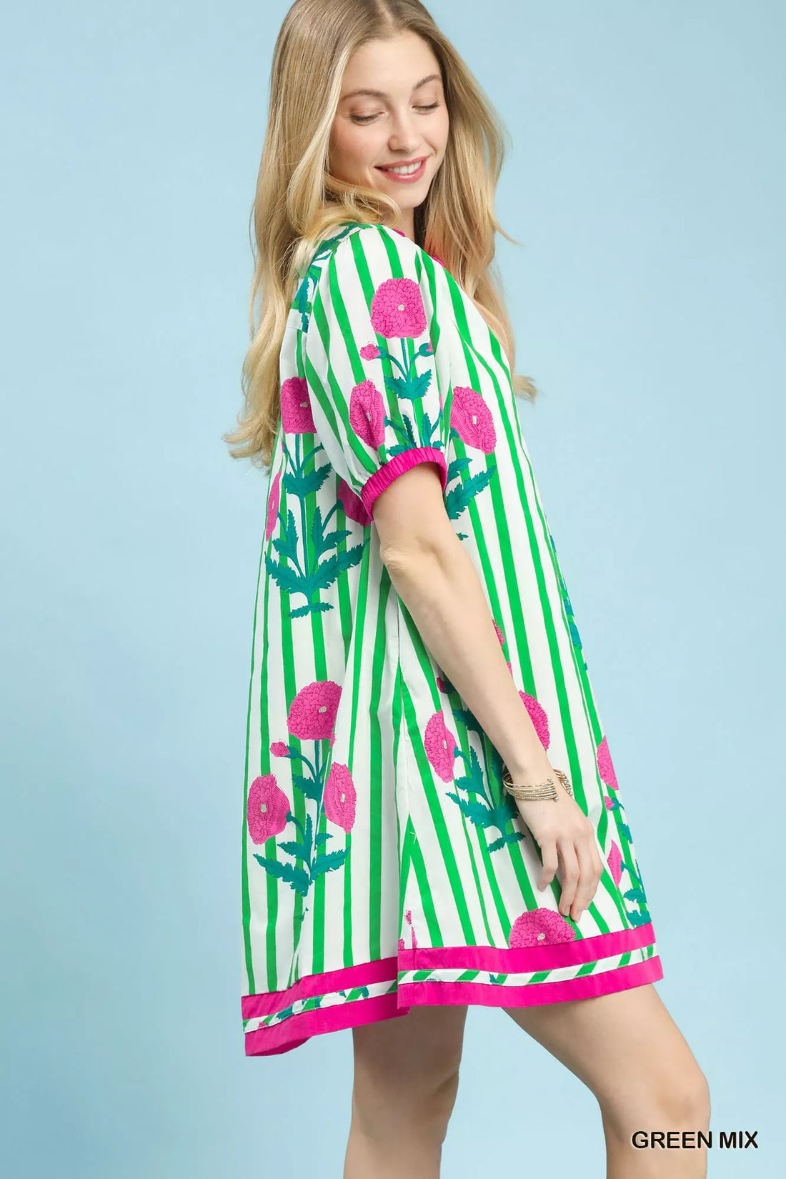 Green striped floral dress with pink trim and short sleeve cuffs, relaxed fit