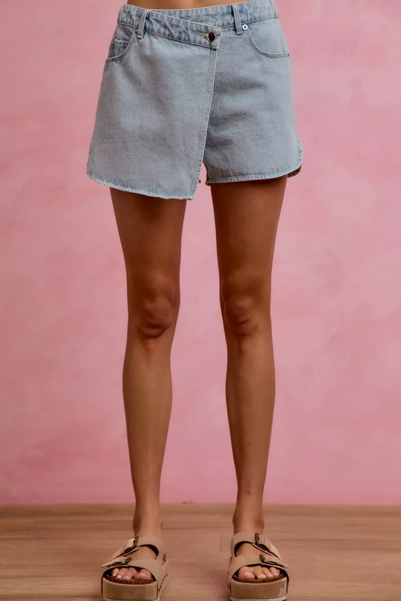 Light blue denim skort with button fly, belt loops, and front pockets