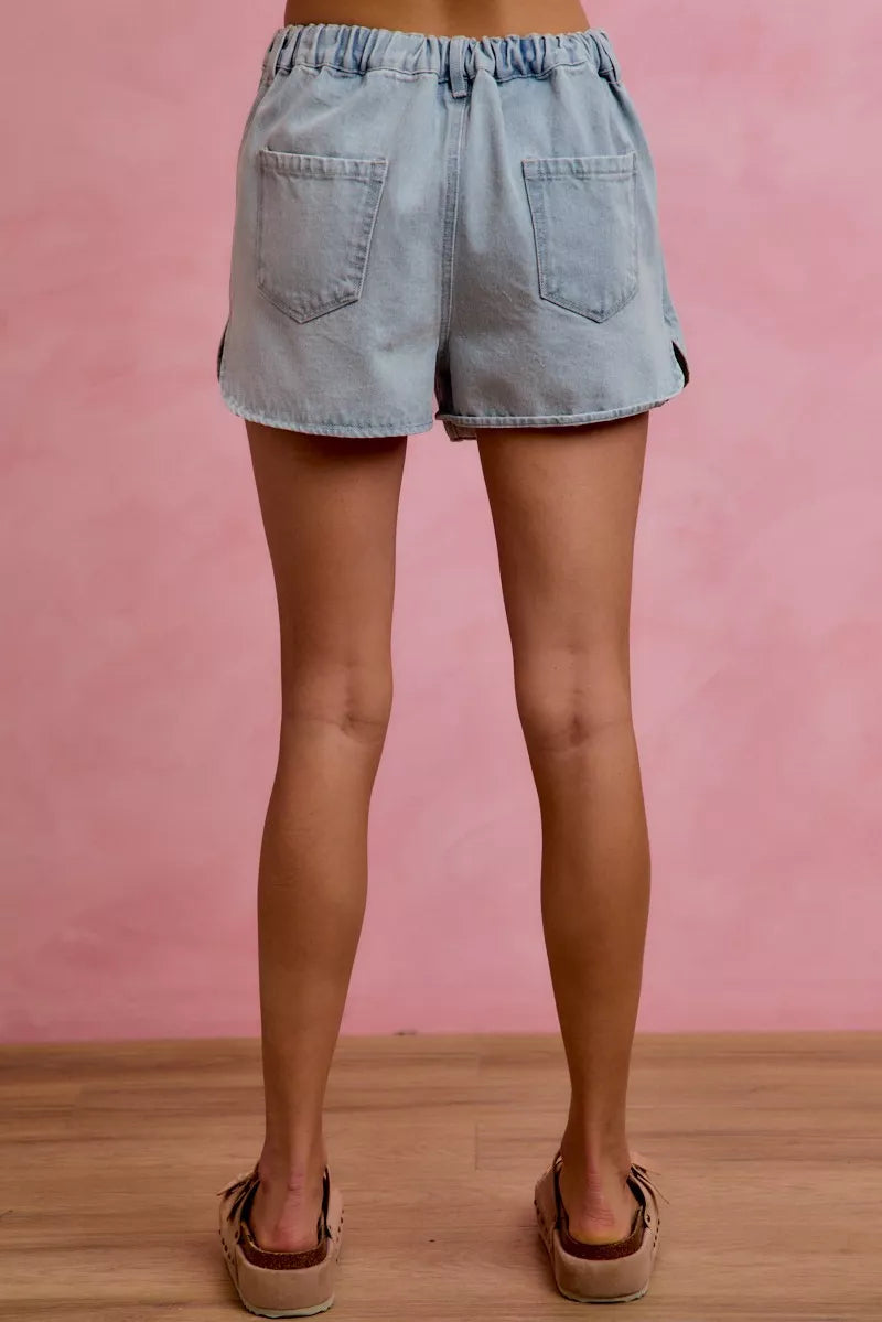 Light blue denim skort with elastic waistband and two back pockets