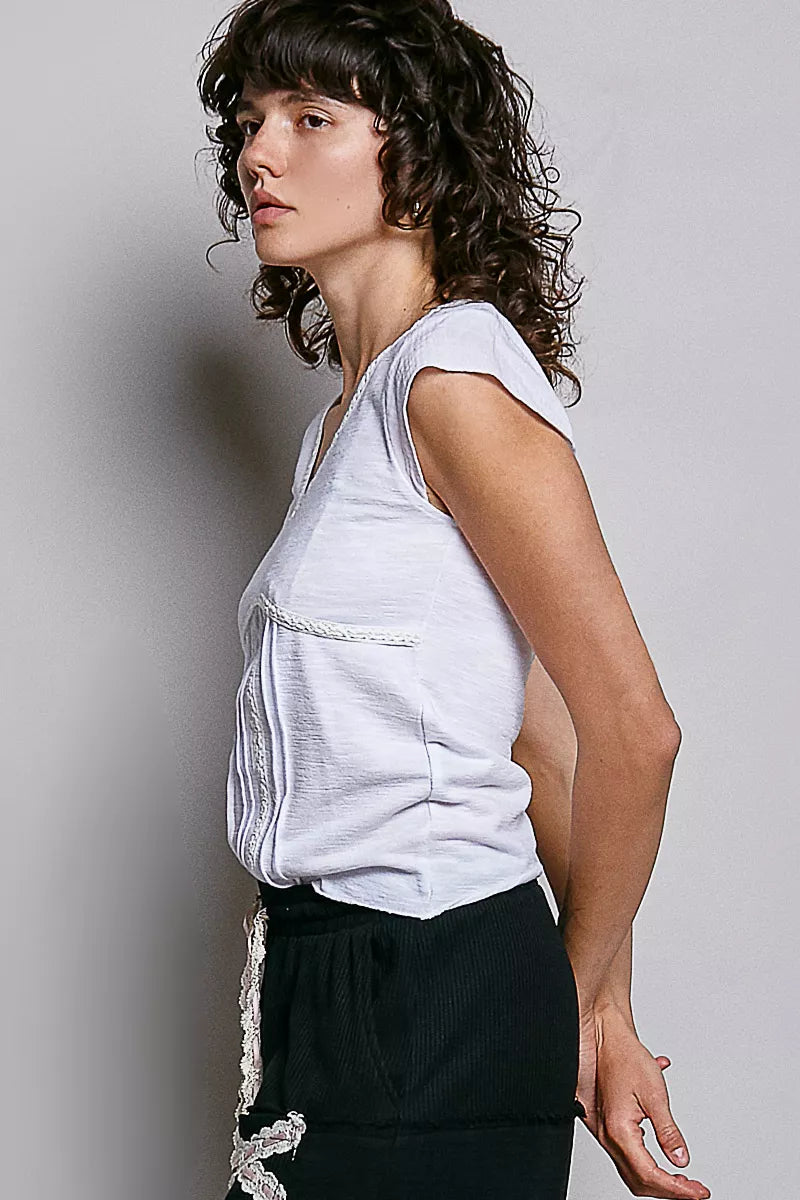 Off-white sleeveless-style textured knit V-neck top with lace-trim neckline