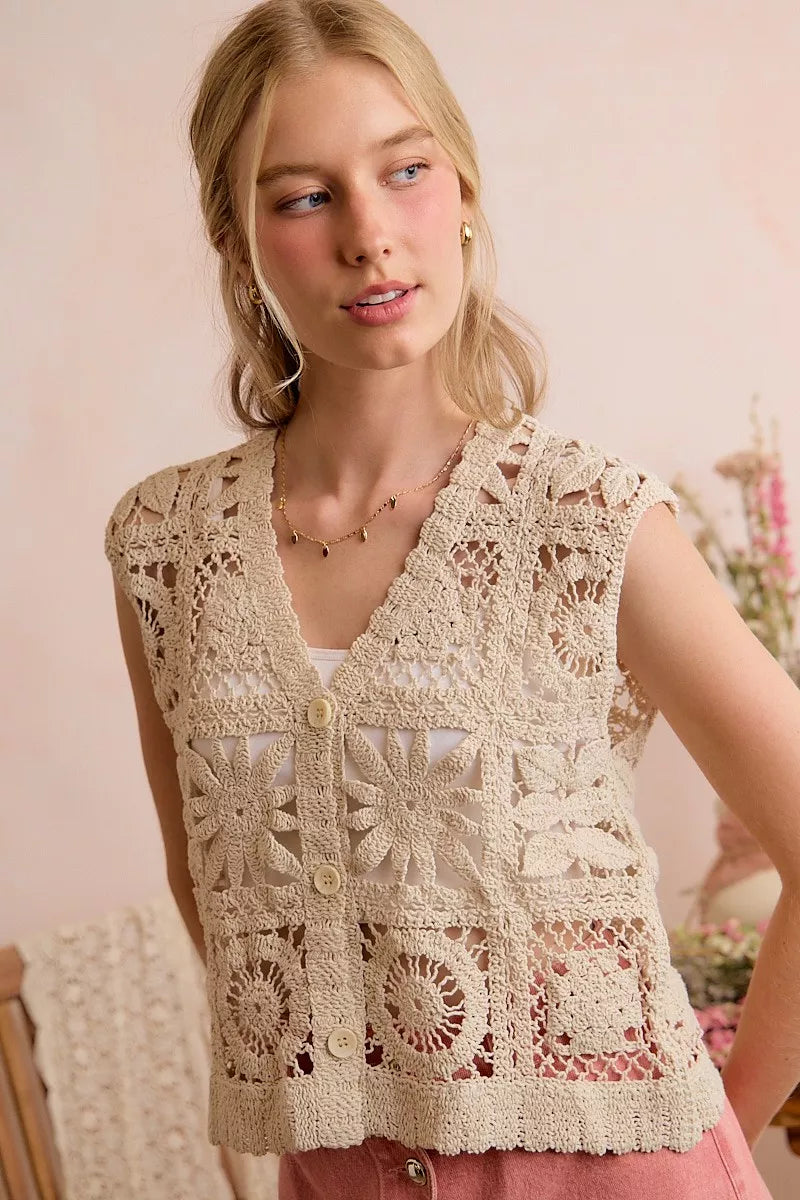 Crochet sleeveless vest top with floral lace pattern and button front