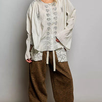 Pale grey embroidered button-front woven shirt with floral motifs, loose fit