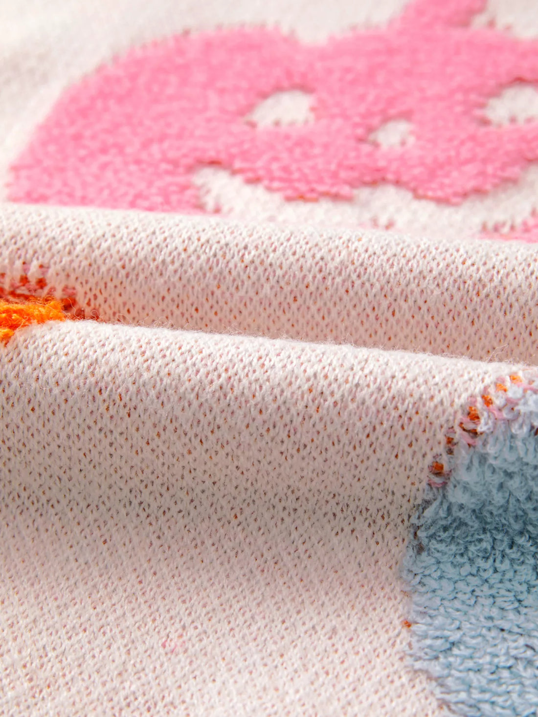 Dusty pink knit sweater with pumpkin pattern detail