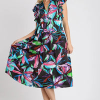 Plus size midi dress with black base and multicolor leaf print, ruffle sleeves.