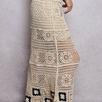 Natural crochet maxi skirt with ruffled waistband and black granny-square cuffs at hem