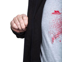 Black softshell jacket opening reveals a fleece-like inner lining