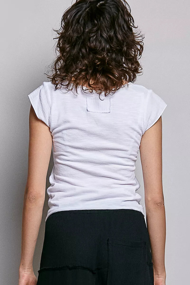 Off-white textured knit top, back view, short sleeves and curved yoke seam
