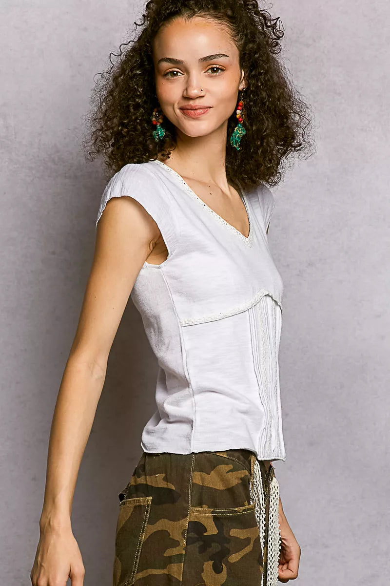 Off-white textured knit V-neck short-sleeve top with lace-trimmed neckline