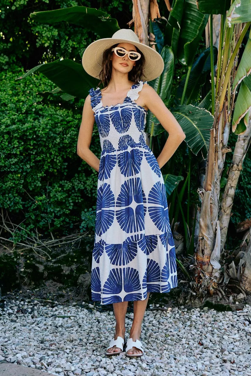 Smocked bodice tiered midi dress with navy-and-white abstract print, sleeveless, lined