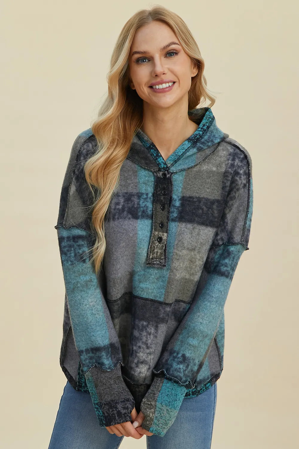 Plaid fleece hoodie with dropped shoulders, front half-zip, hood, kangaroo pocket, front view.