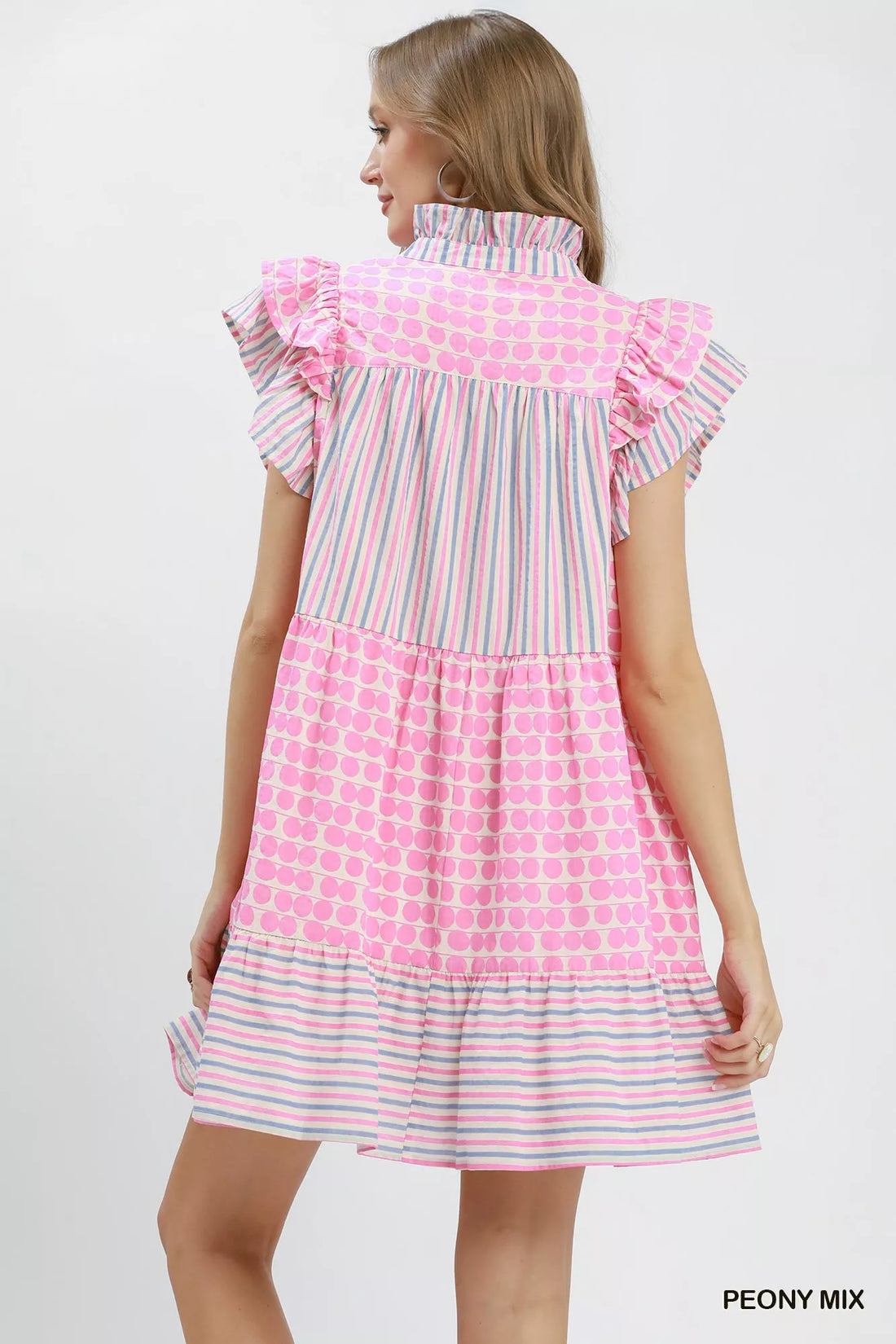 Pink tiered dress with ruffled back yoke, flutter sleeves, dot and stripe pattern