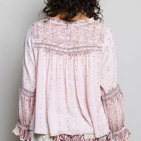 Rose pink lace-trim blouse with embroidered yoke and ruffled cuffs, back view