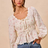 White floral clip-dot peplum blouse with scalloped lace neckline and gathered ruched center