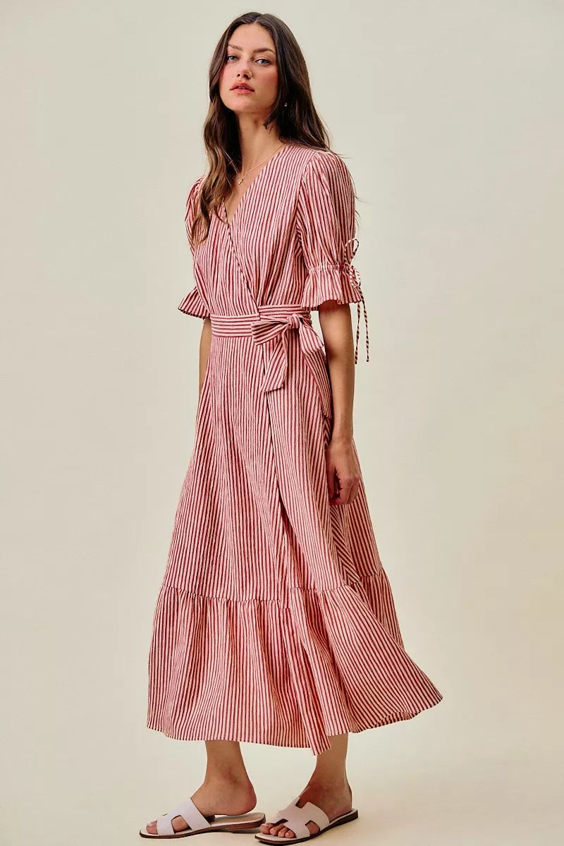 Red striped wrap midi dress with short puff sleeves and knotted belt; ruffled tiered skirt