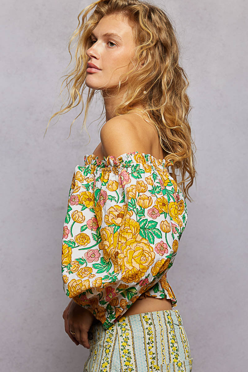 Floral off-shoulder smocked blouse with long puff sleeves, side view