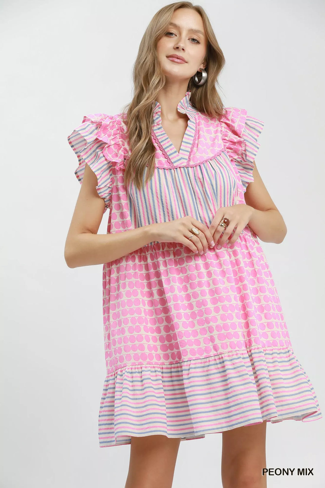 Pink patchwork tiered dress with ruffled flutter sleeves and V-neck, striped and dot print