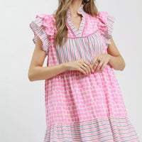 Pink patchwork tiered dress with ruffled flutter sleeves and V-neck, striped and dot print