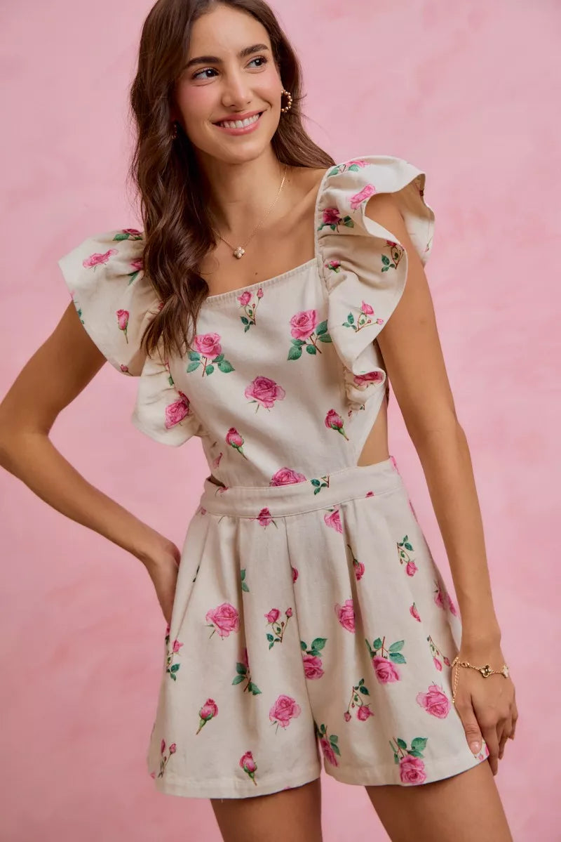 Ivory floral romper with ruffled cap sleeves and cut-out waist, pink rose print