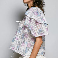 Side view floral tie-front ruffle blouse with lace trim, off-white pastel print
