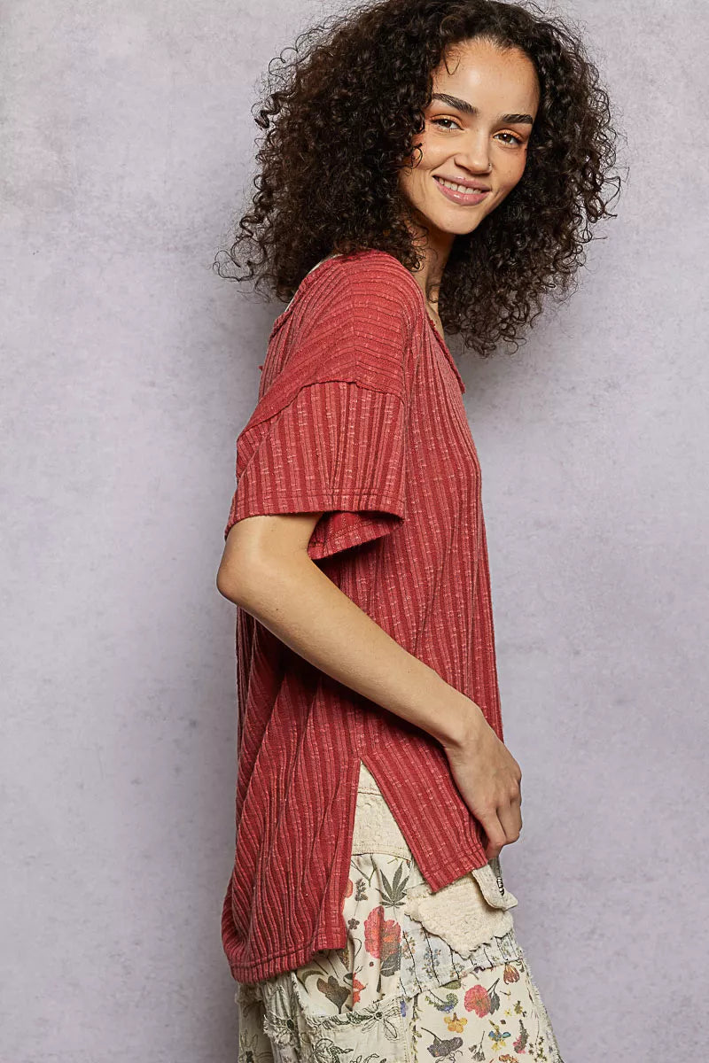 Terra cotta ribbed knit V-neck t-shirt with short sleeves and visible side slit