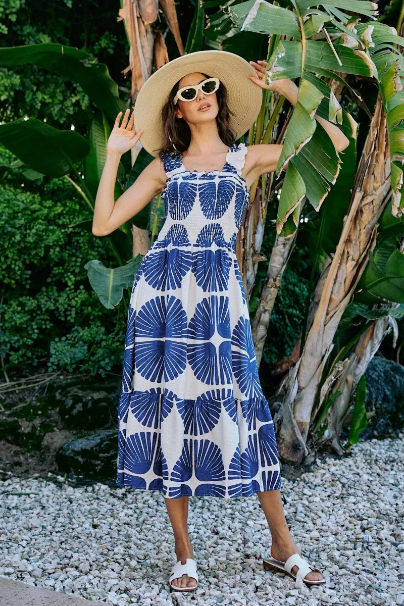 Square-neck sleeveless tiered midi dress with navy abstract print, smocked bodice